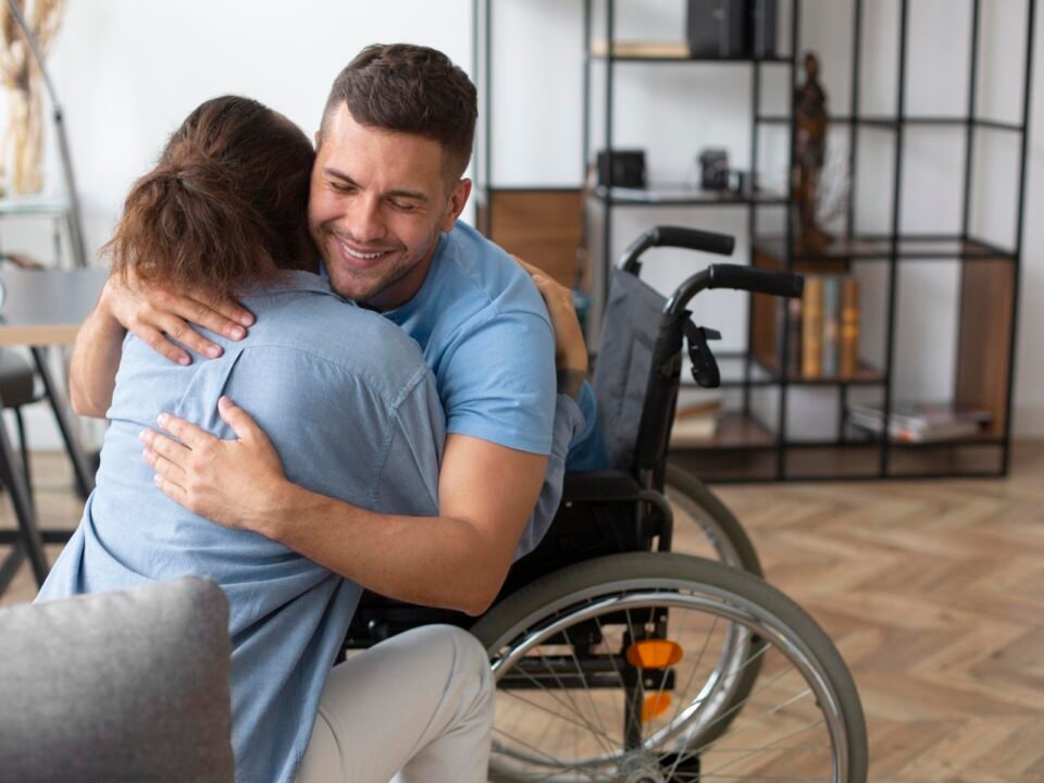 Cadeirante abraçando sua médica